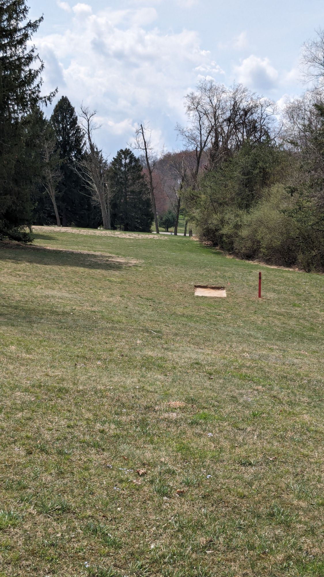 Some tee pads are swamped after rain so need to improvise.