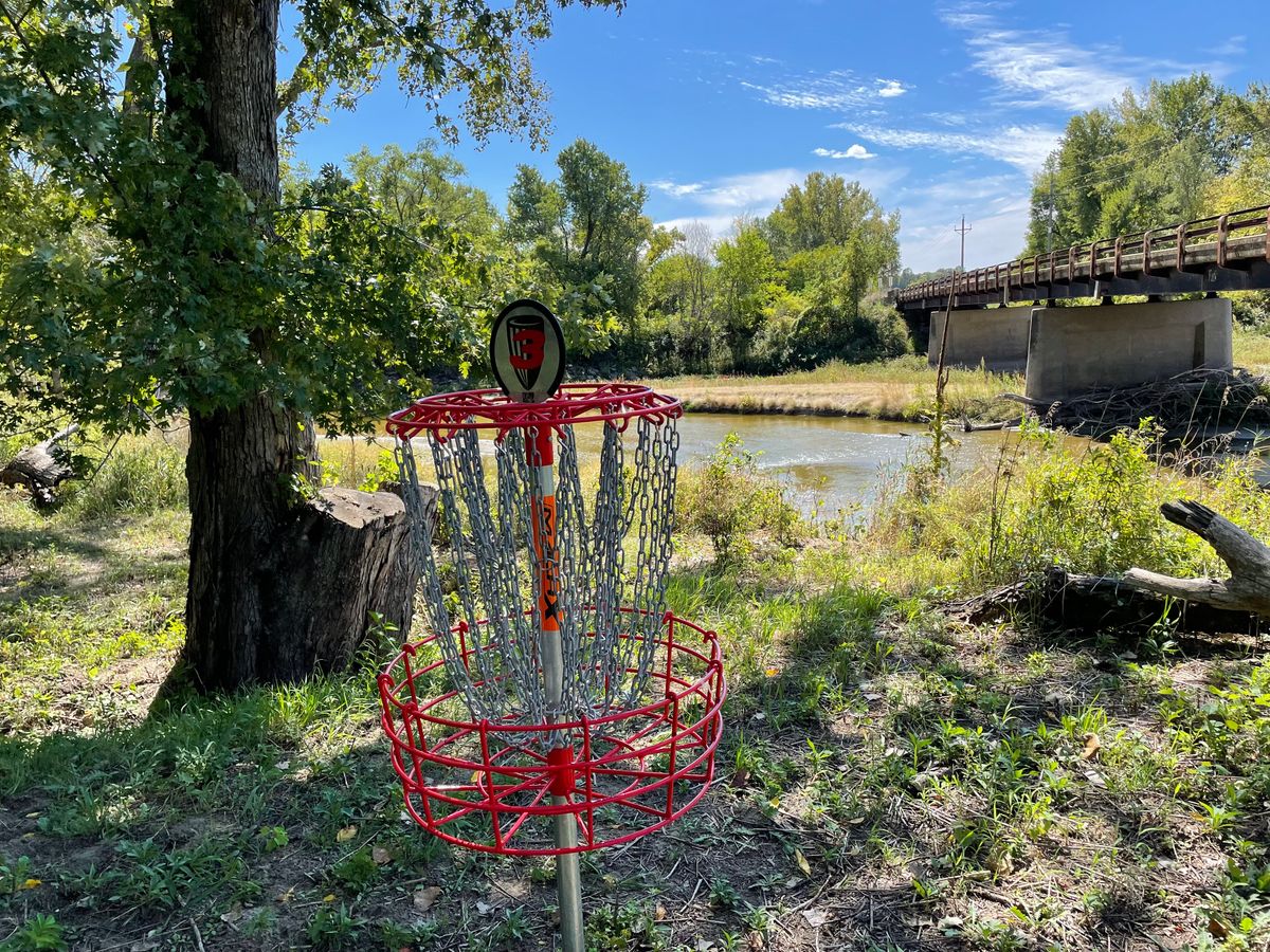 Hole 3 basket with River as back drop