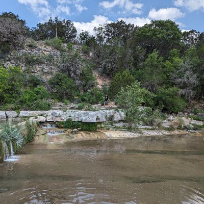 Coolest hole on the course. Throw across the river and walk across the dam to finish out.