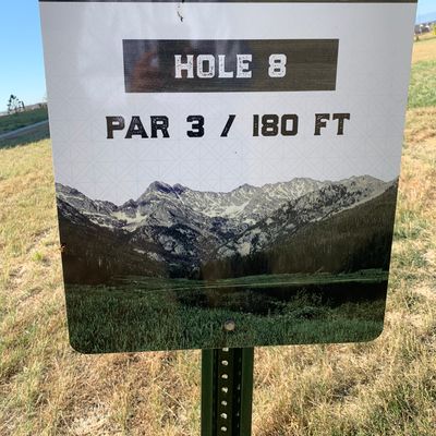 Tee off from dirt field.