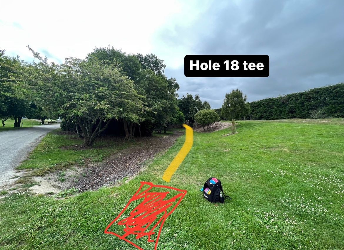Hole 18 tee. Stay right around bend to avoid playground. Check for pedestrians. 
