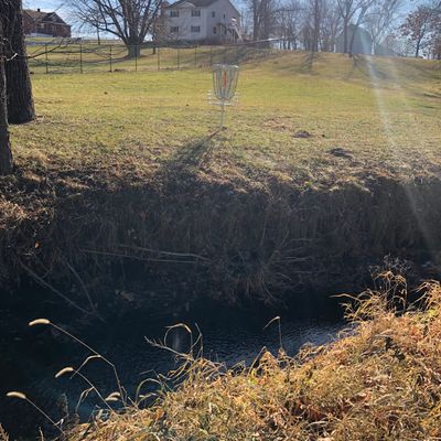 Back side of basket with creek, makes for fun death putts